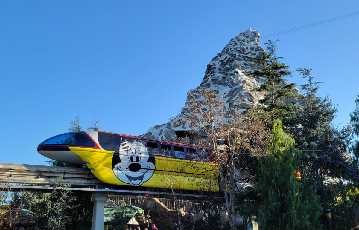 The monorail at Disneyland going past the Matterhorn